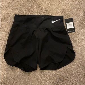 black Nike shorts.